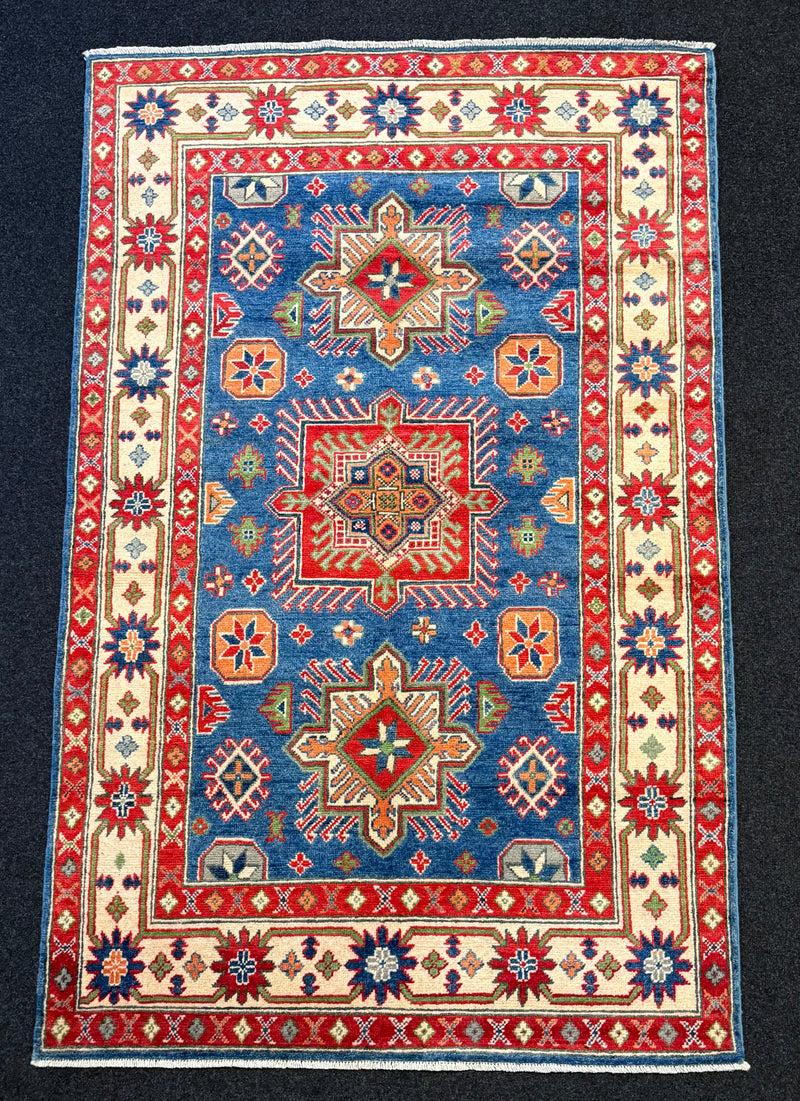 Handknuten Kazak‑matta — 188 × 119 cm