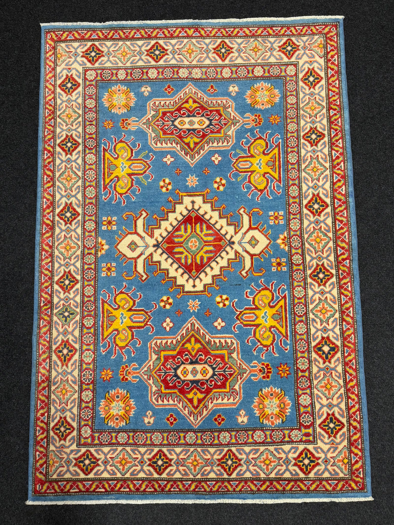 Handknuten Kazak‑matta — 181 × 119 cm