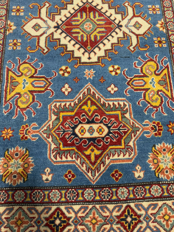 Handknuten Kazak‑matta — 181 × 119 cm