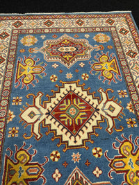 Handknuten Kazak‑matta — 181 × 119 cm