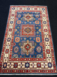 Handknuten Kazak‑matta — 188 × 119 cm